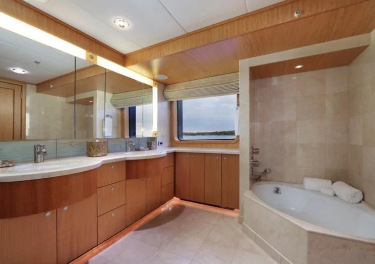 a bathroom with a large tub aboard HELIOS 2 Yacht for Sale