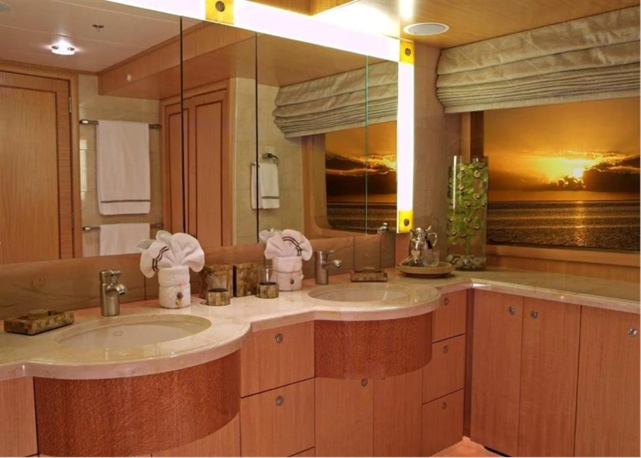 a bathroom with a large mirror aboard HELIOS 2 Yacht for Sale