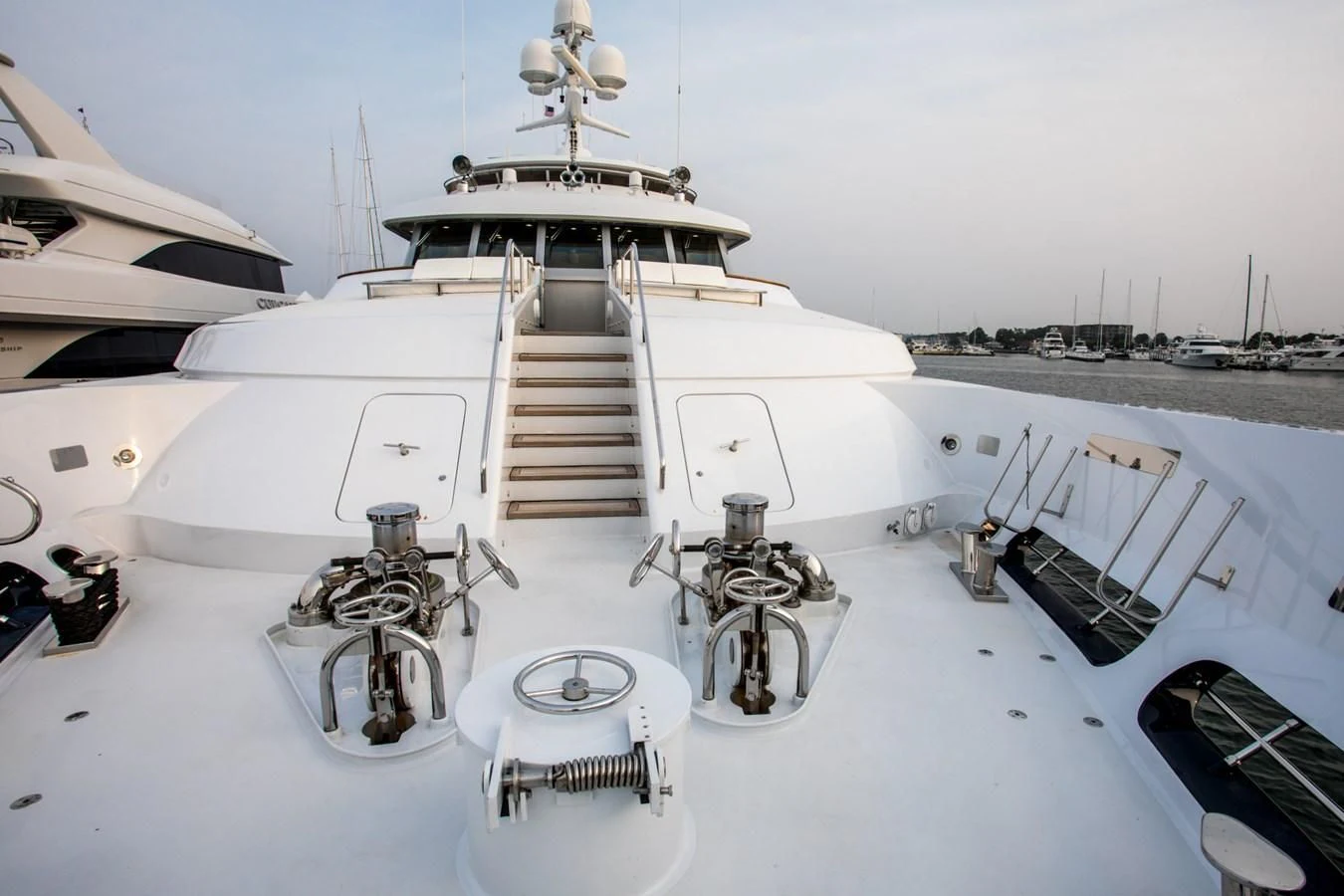 a large white ship with a staircase aboard HELIOS 2 Yacht for Sale