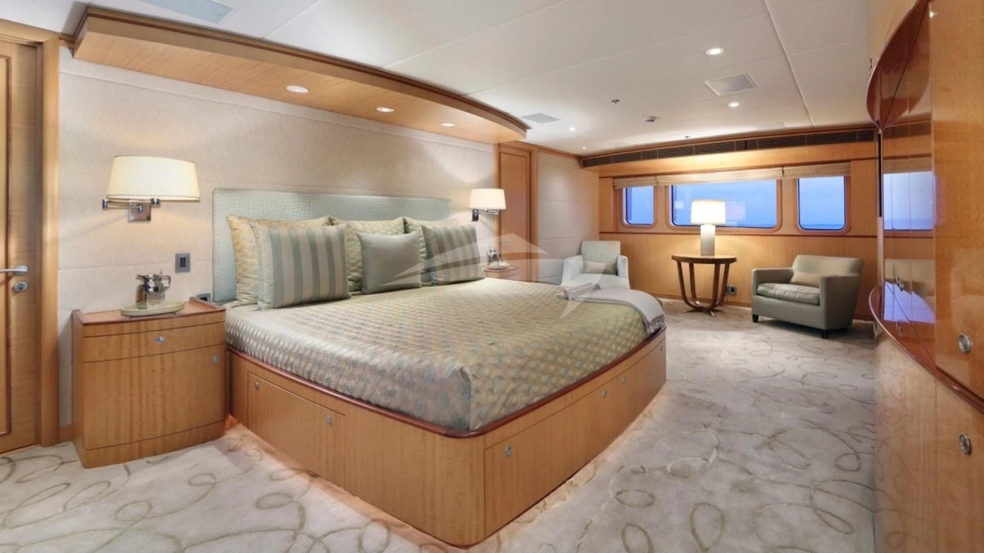 a large bedroom with a bed and a couch aboard HELIOS 2 Yacht for Sale