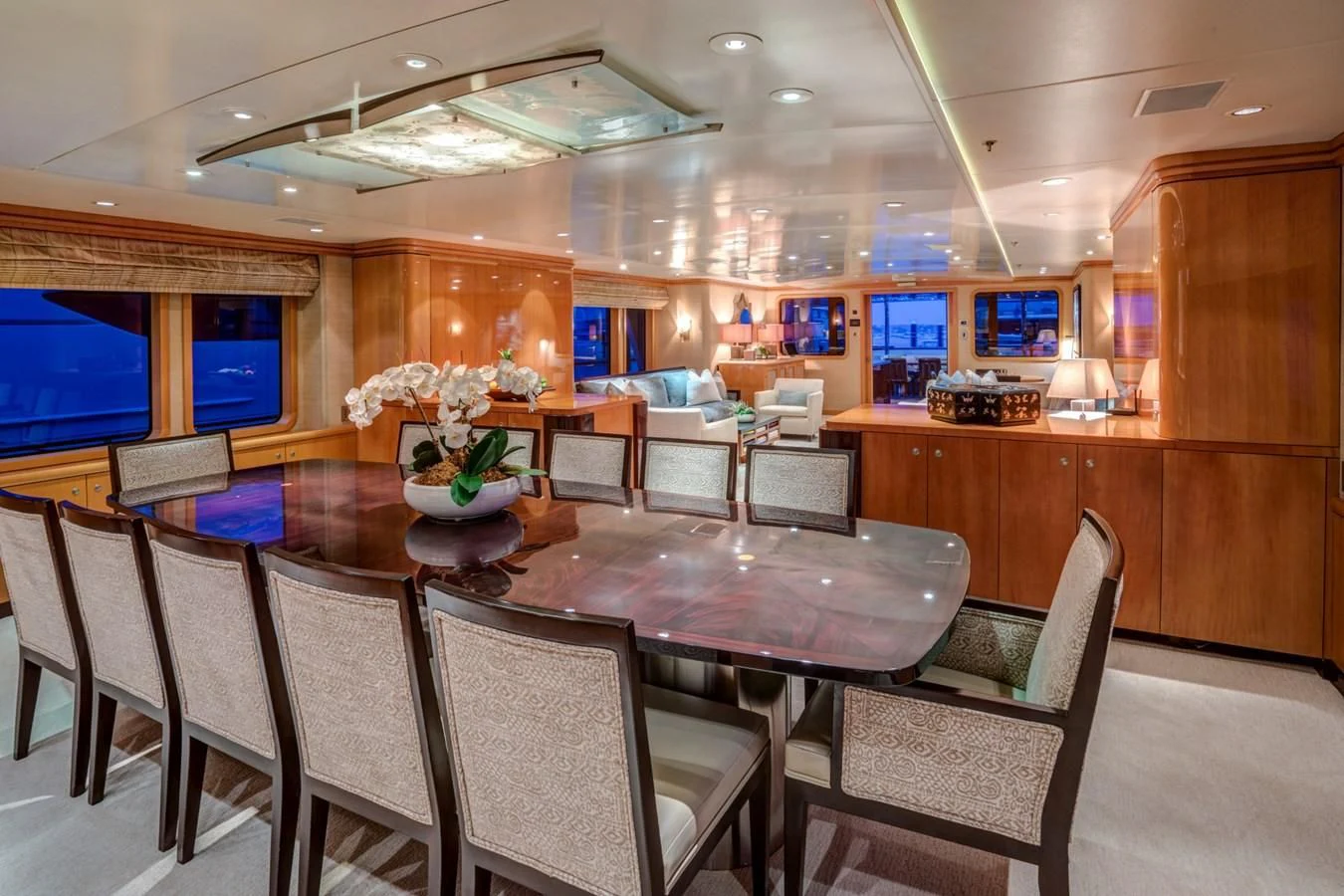 a room with a table chairs and a television aboard HELIOS 2 Yacht for Sale