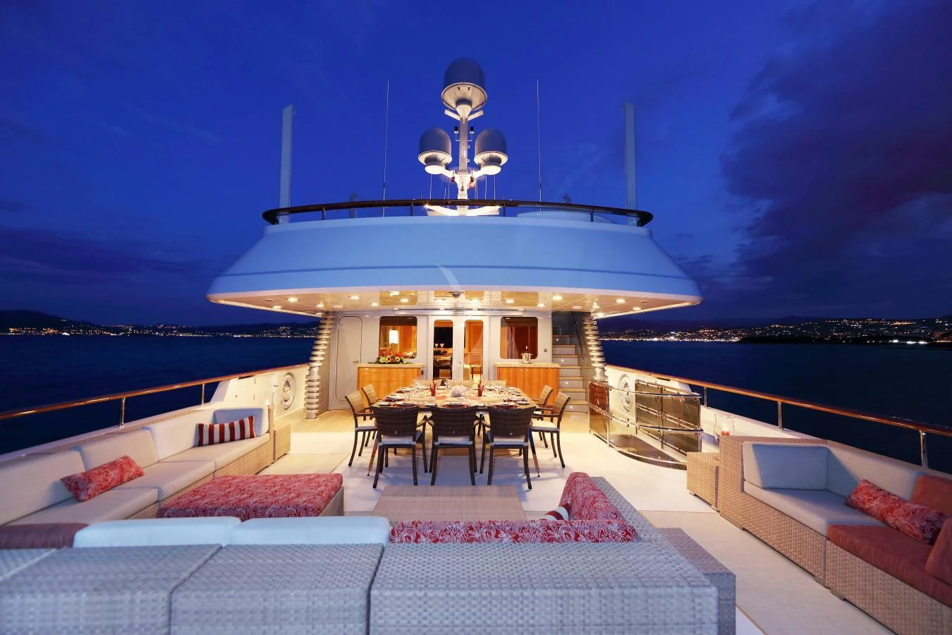 a house with a large white roof and a table and chairs on the patio aboard HELIOS 2 Yacht for Sale