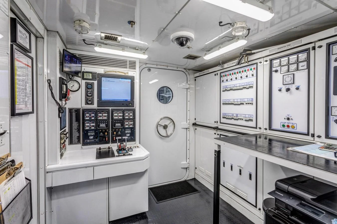 a room with white cabinets and a computer on the wall aboard HELIOS 2 Yacht for Sale