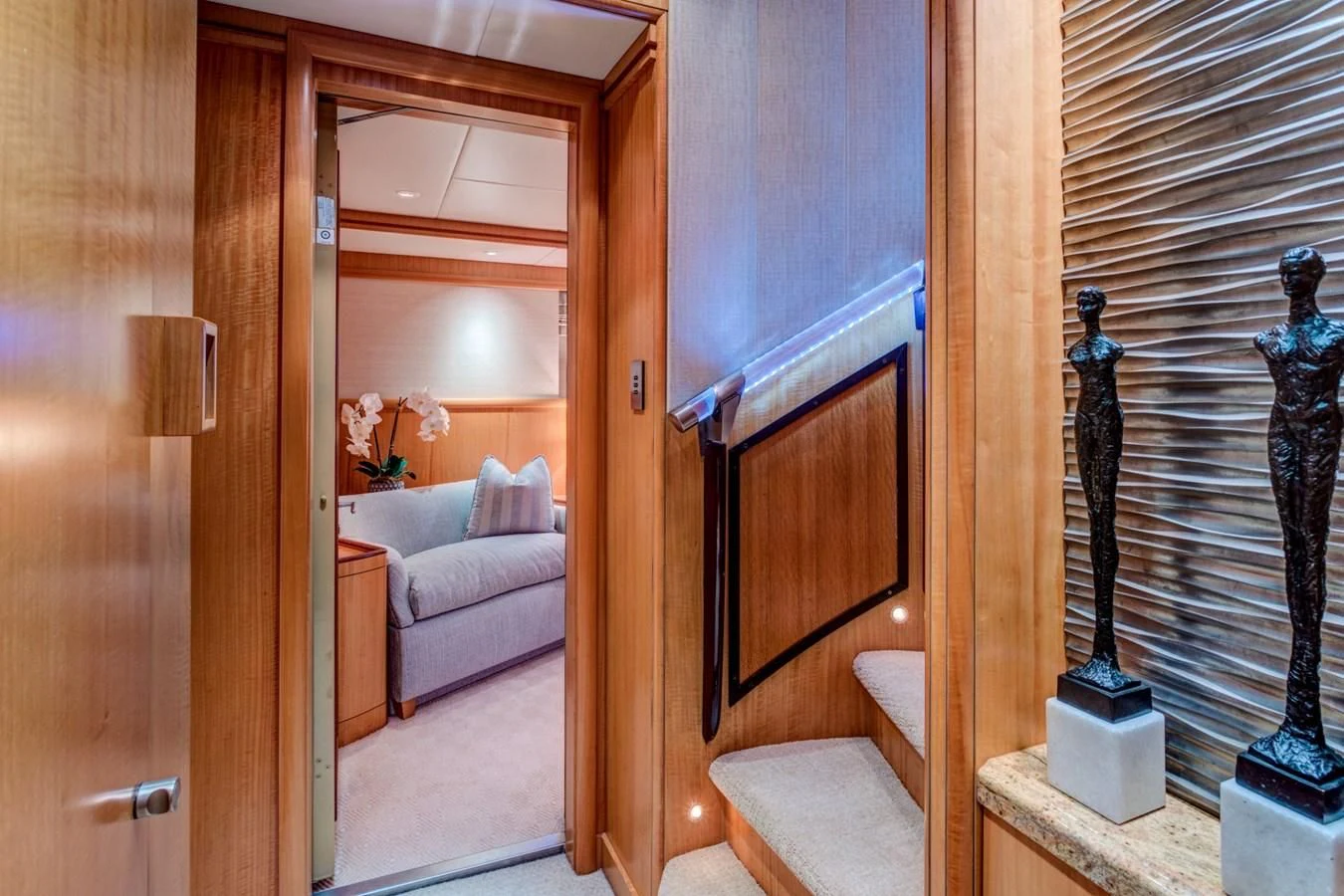 a room with a bed and a chair aboard HELIOS 2 Yacht for Sale