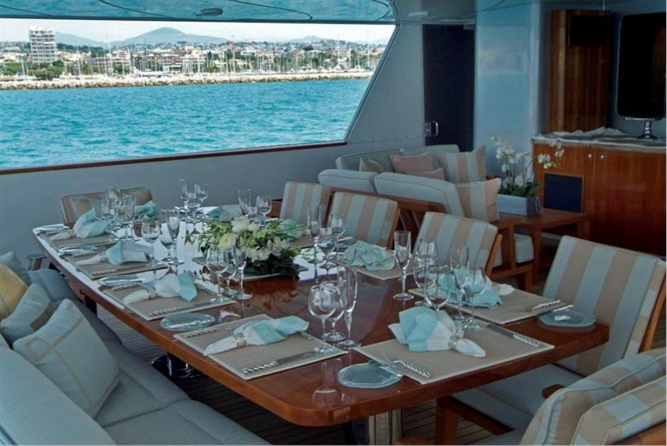 a table set for a dinner aboard HELIOS 2 Yacht for Sale