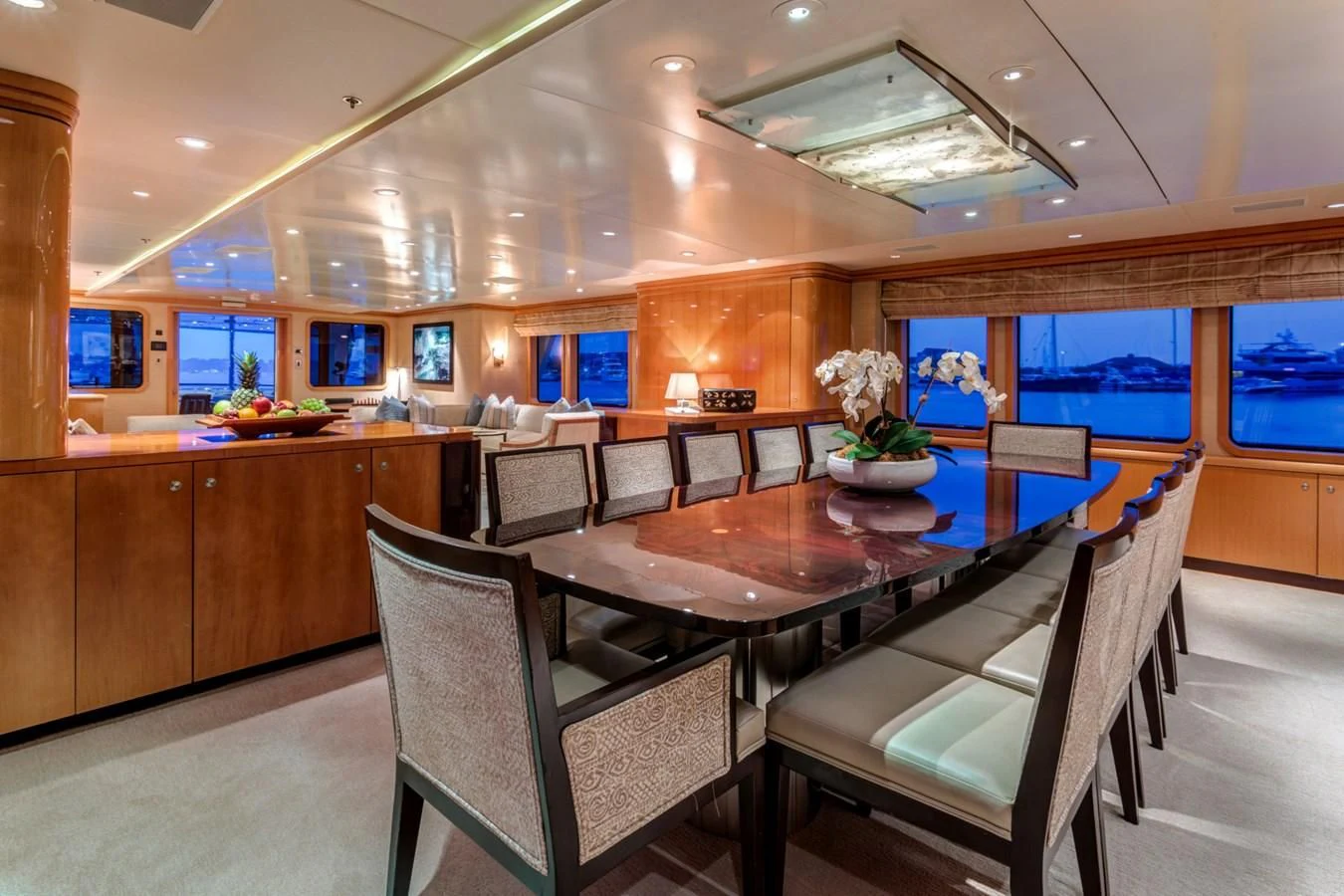 a large room with a table and chairs aboard HELIOS 2 Yacht for Sale