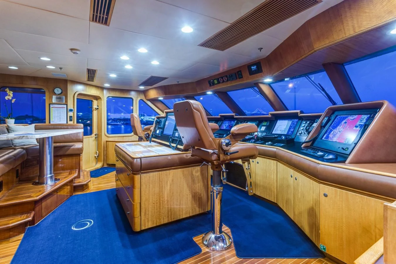 a room with a desk and chairs aboard HELIOS 2 Yacht for Sale