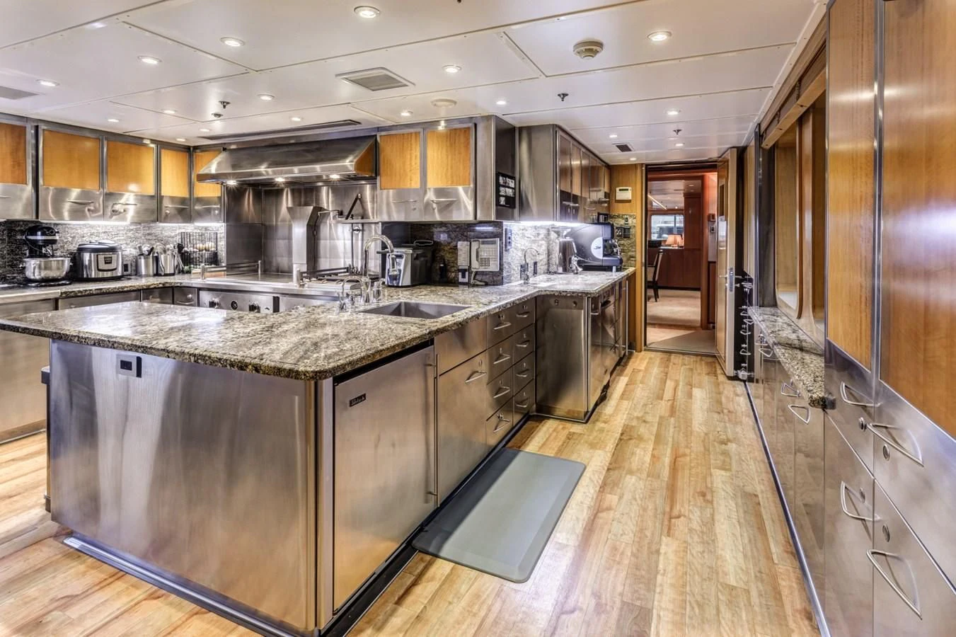 a large kitchen with stainless steel appliances aboard HELIOS 2 Yacht for Sale