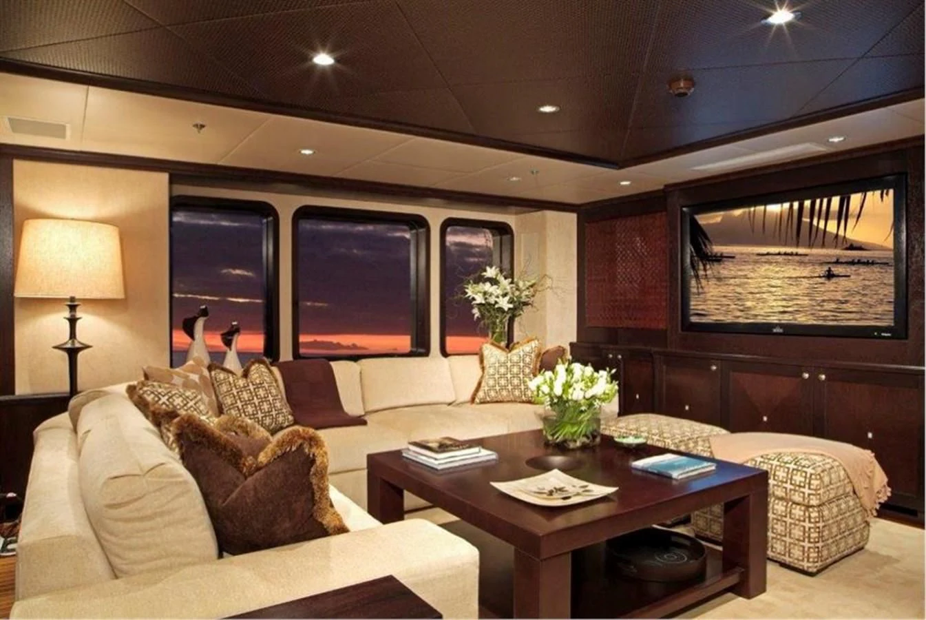 a living room with a table and couches aboard HELIOS 2 Yacht for Sale