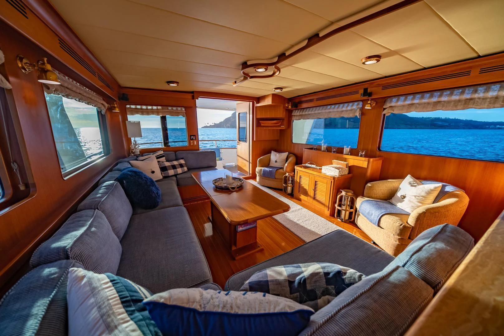 a living room with a large window aboard HALCYON SEAS Yacht for Sale