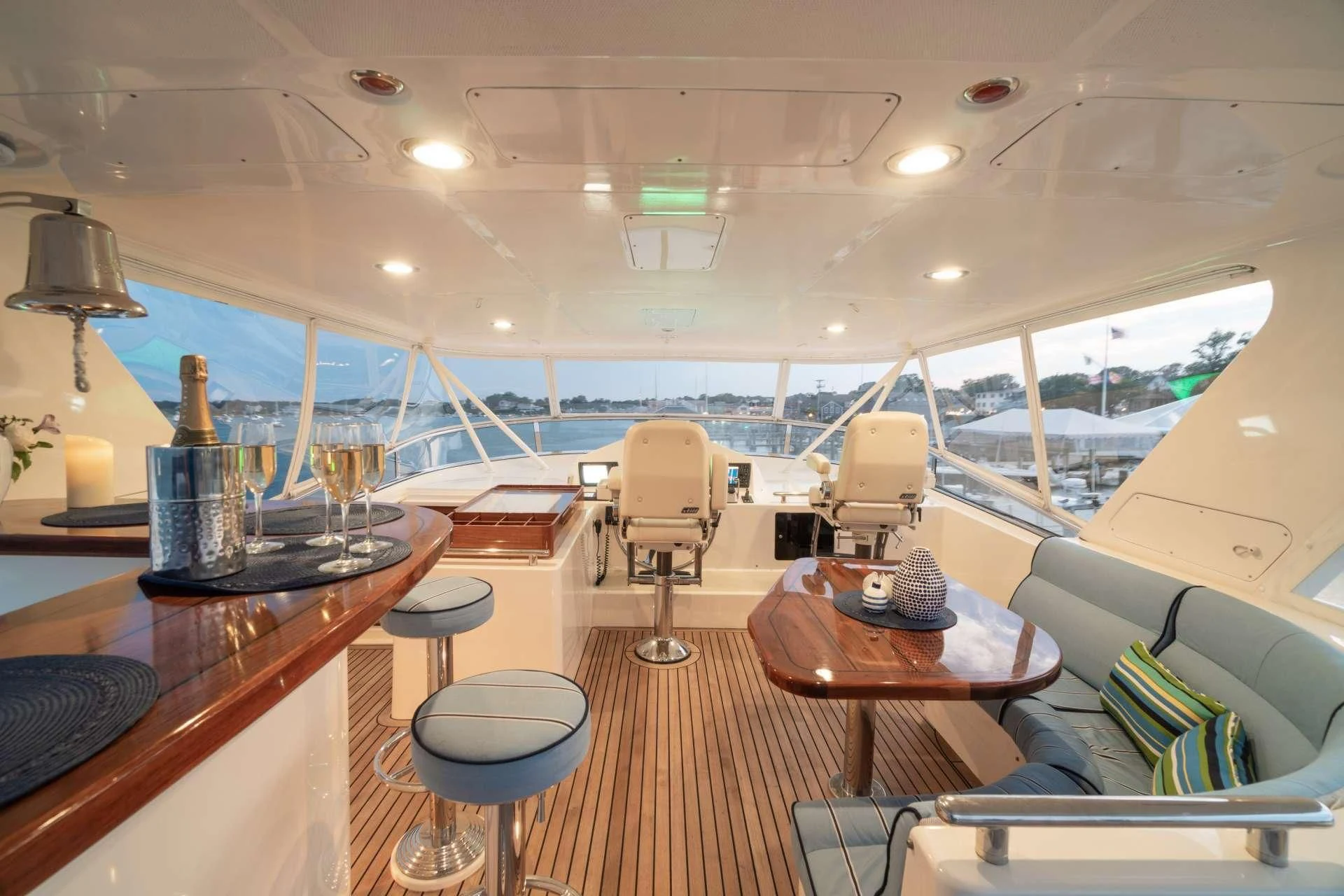inside of a building with a large window and a table with chairs and a large window aboard HALCYON SEAS Yacht for Sale