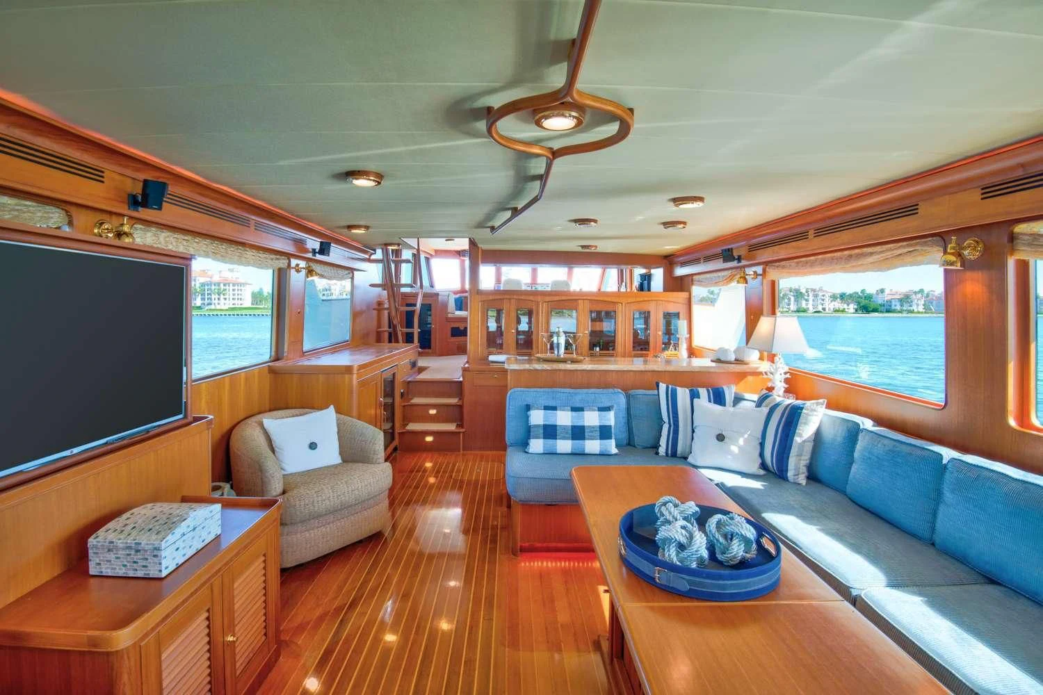 a living room with a large screen aboard HALCYON SEAS Yacht for Sale