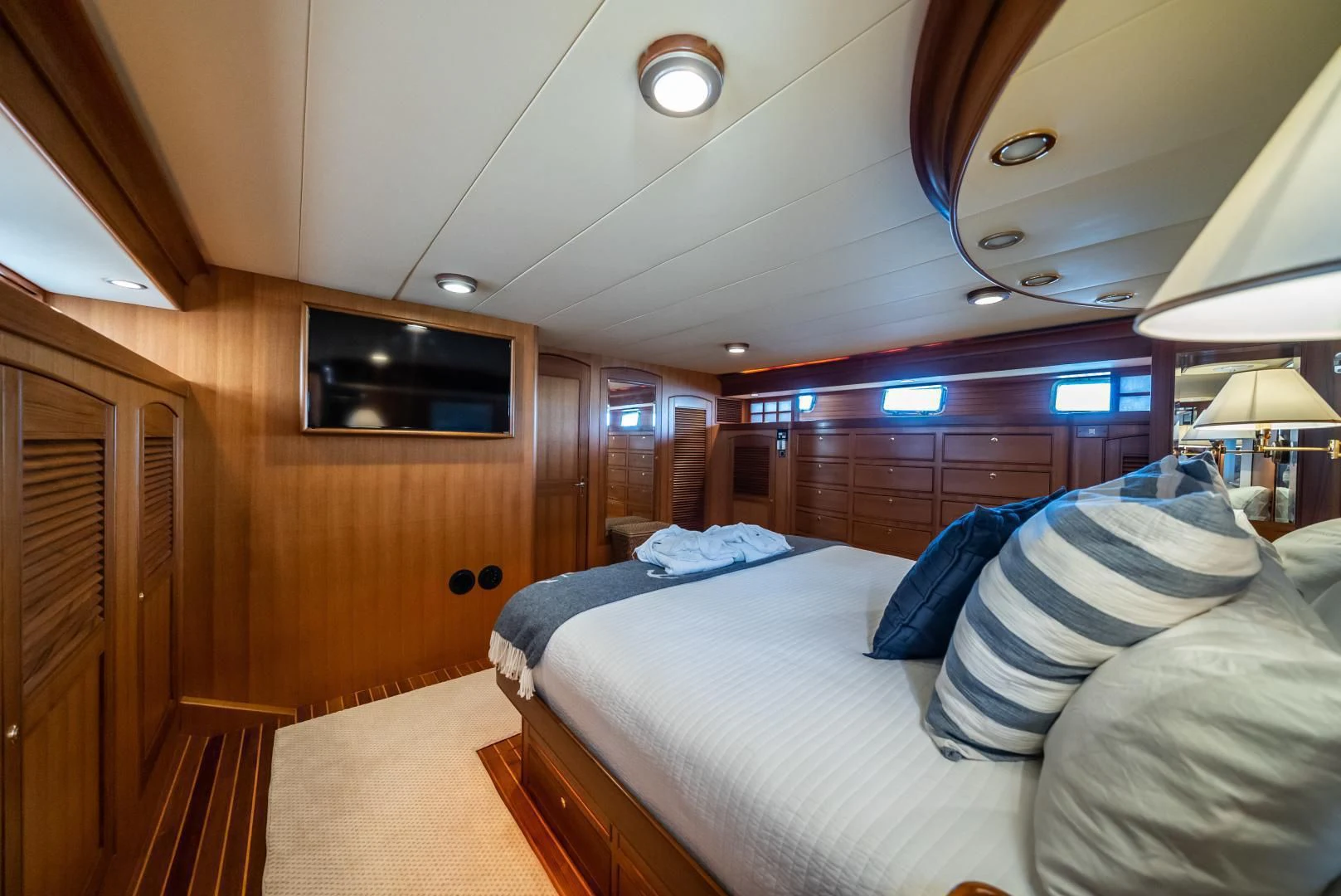 a room with a bed and a television aboard HALCYON SEAS Yacht for Sale
