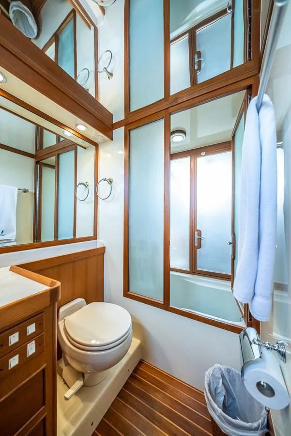 a bathroom with a toilet and a sink aboard HALCYON SEAS Yacht for Sale
