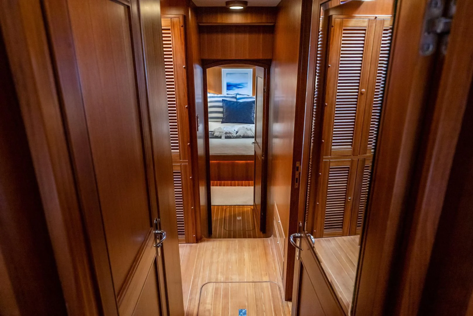 a hallway with wooden doors aboard HALCYON SEAS Yacht for Sale