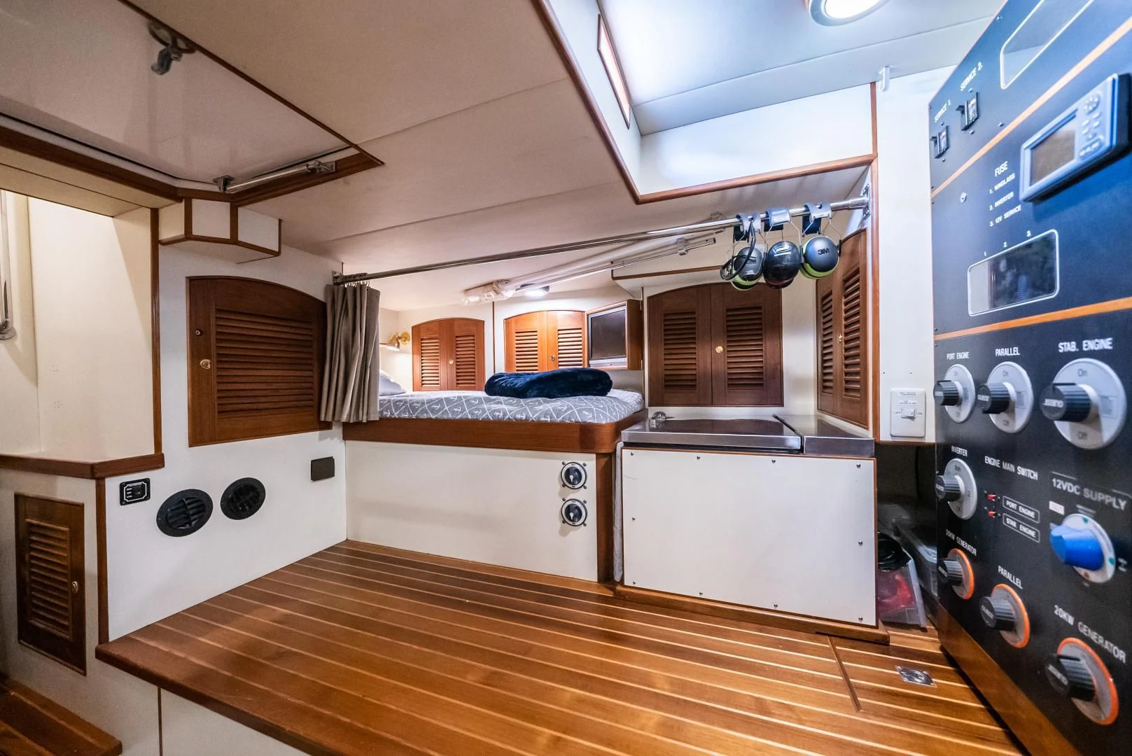 a kitchen with a wood floor aboard HALCYON SEAS Yacht for Sale