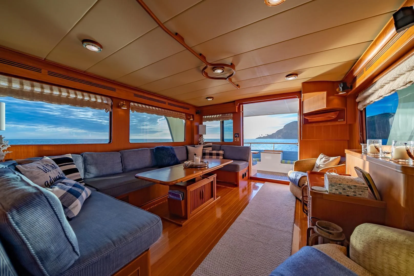 a living room with a large window aboard HALCYON SEAS Yacht for Sale