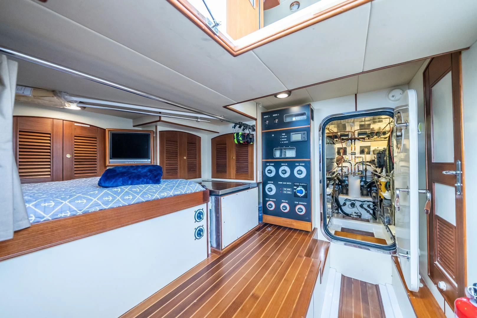 a room with a bed and a desk aboard HALCYON SEAS Yacht for Sale