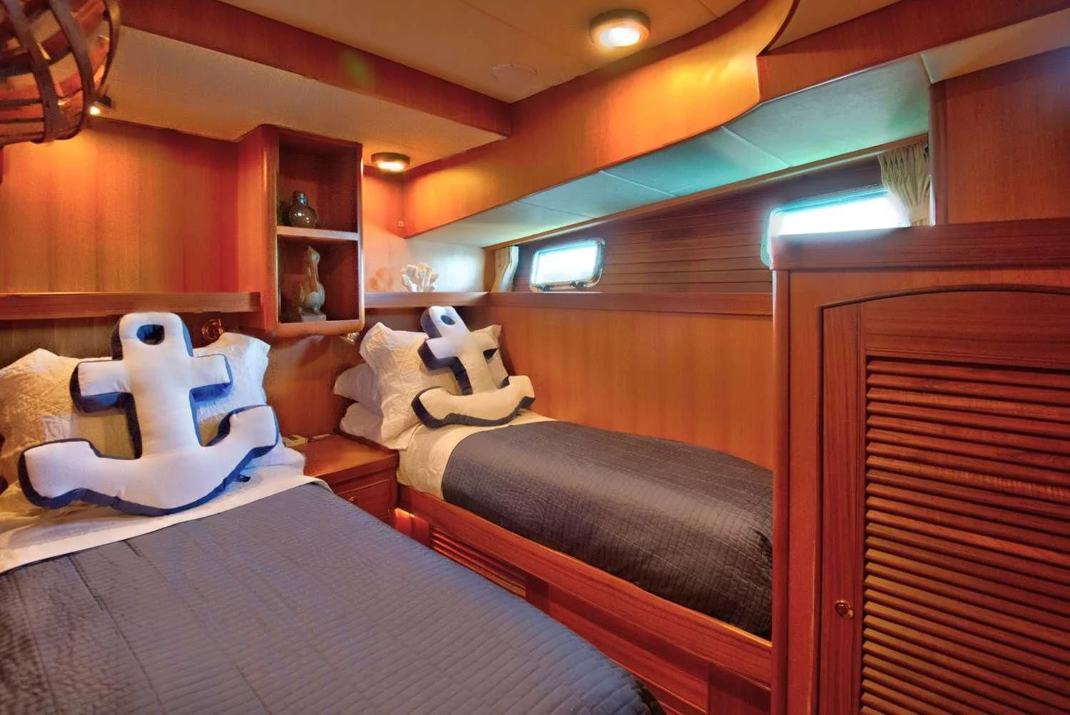 a room with a bed and stuffed animals aboard HALCYON SEAS Yacht for Sale