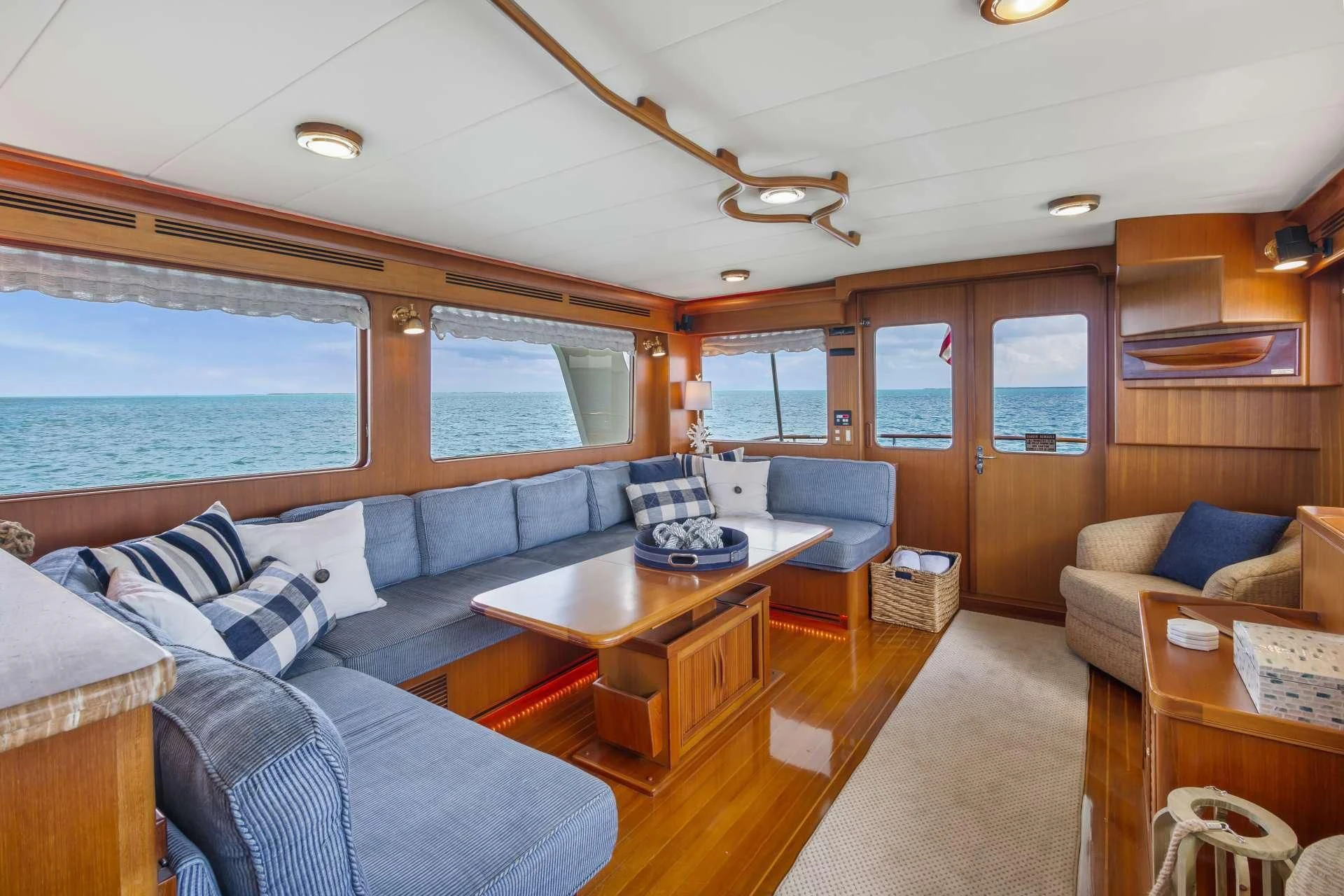 a living room with a couch and a table aboard HALCYON SEAS Yacht for Sale