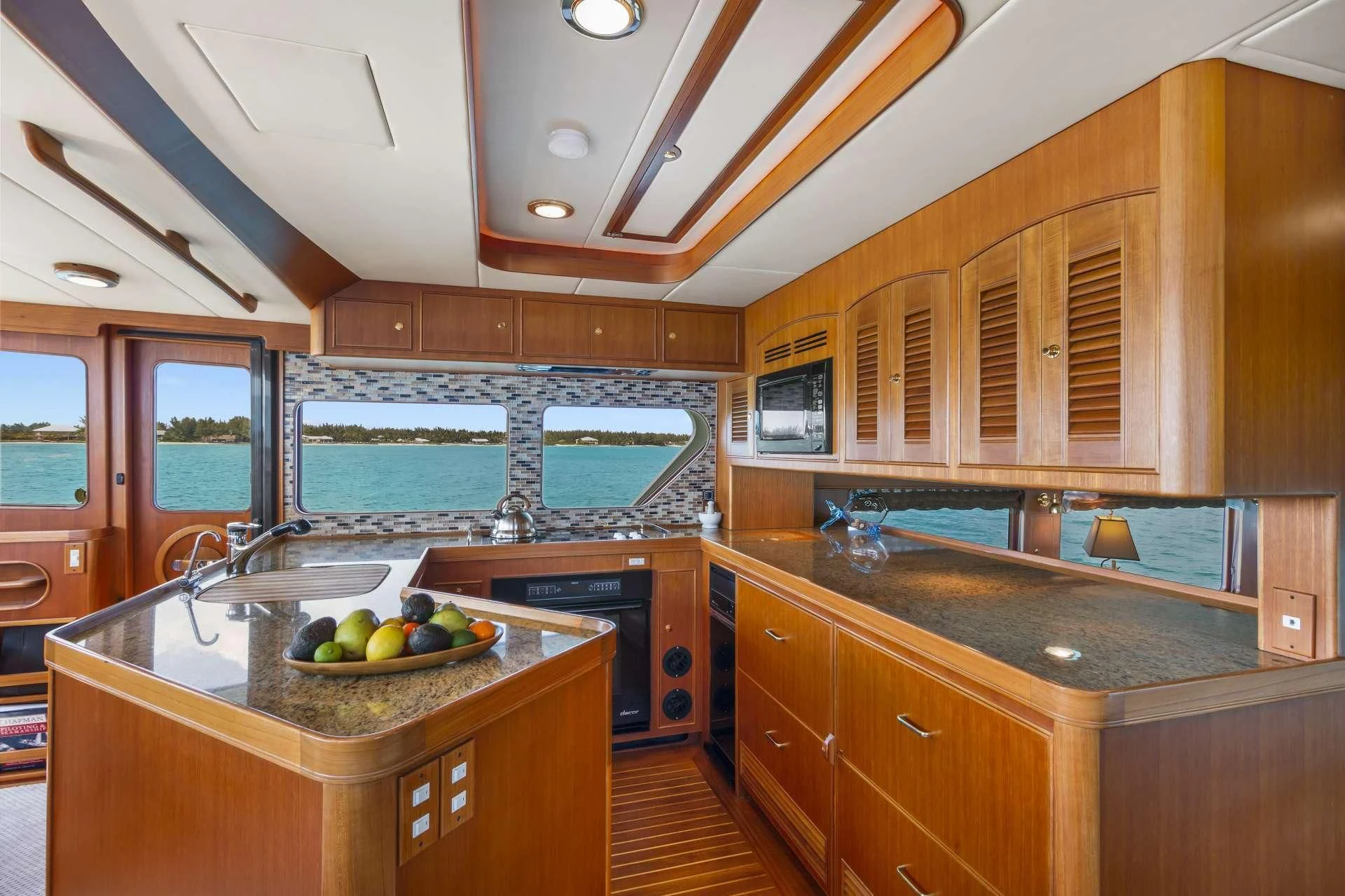 a kitchen with wooden cabinets aboard HALCYON SEAS Yacht for Sale