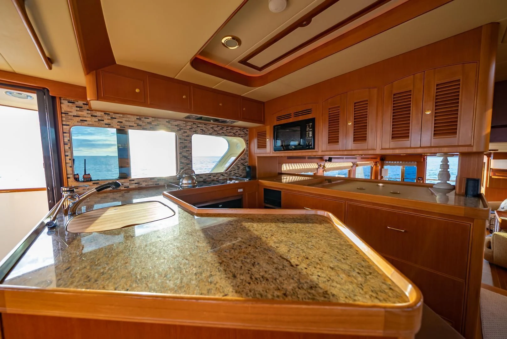a kitchen with a marble counter top aboard HALCYON SEAS Yacht for Sale