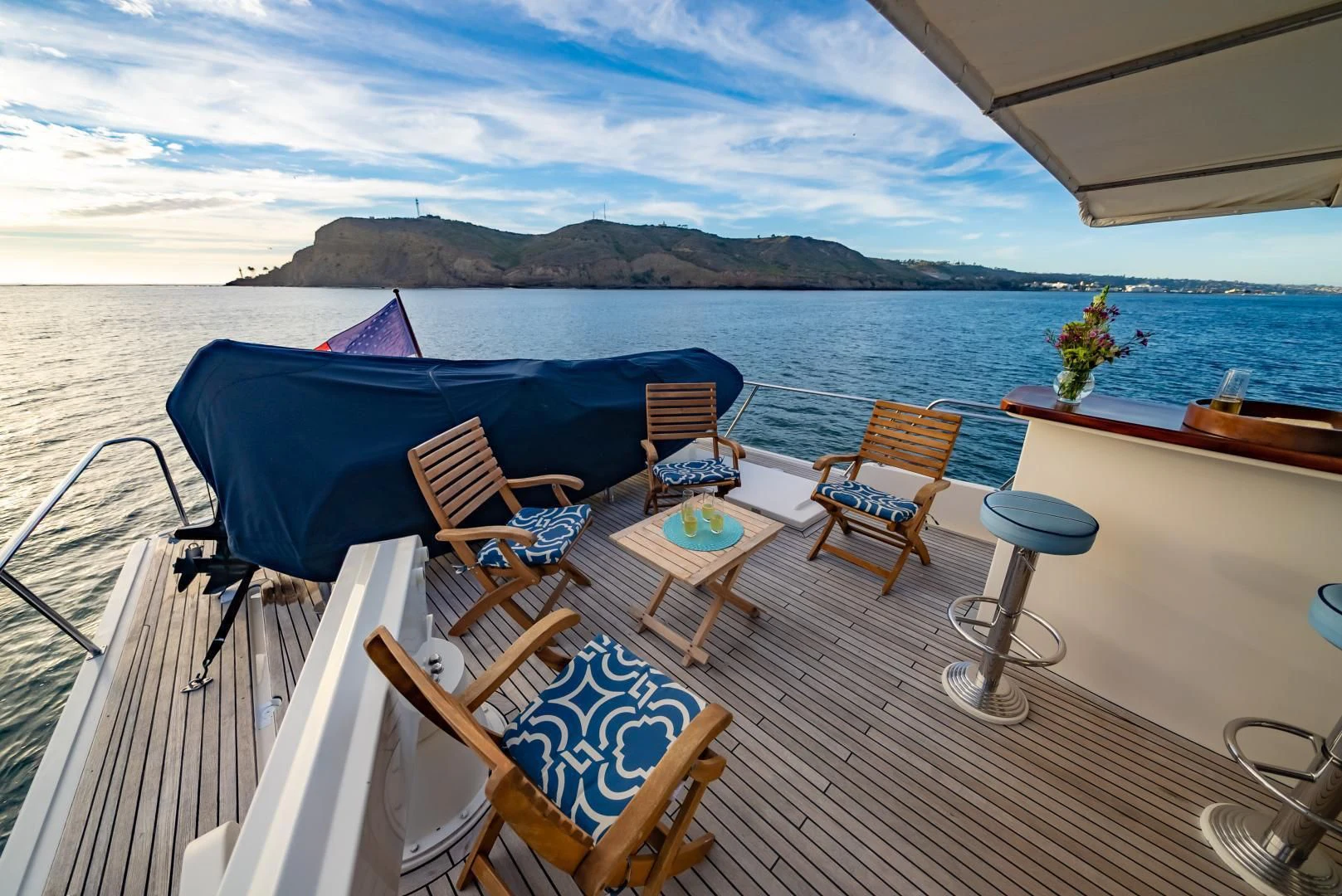 a deck with chairs and tables on it aboard HALCYON SEAS Yacht for Sale