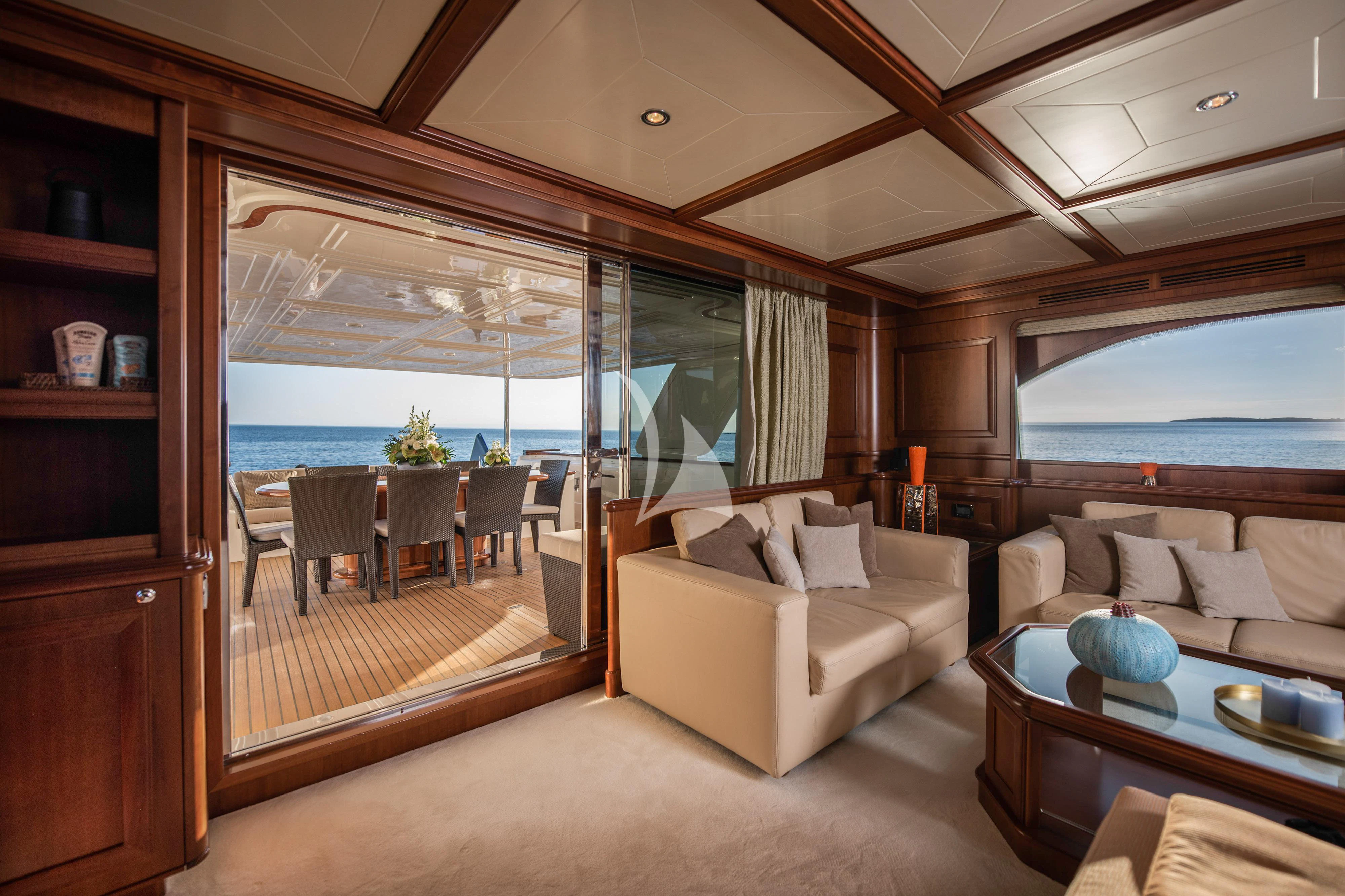a living room with a large glass window aboard KLOBUK Yacht for Charter
