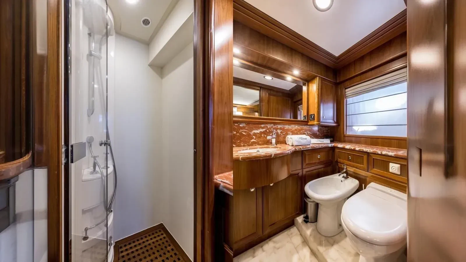 a bathroom with a toilet and a sink aboard KLOBUK Yacht for Charter