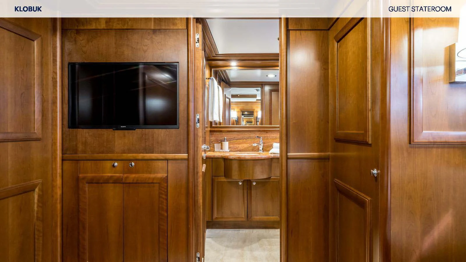 a kitchen with wooden cabinets aboard KLOBUK Yacht for Charter