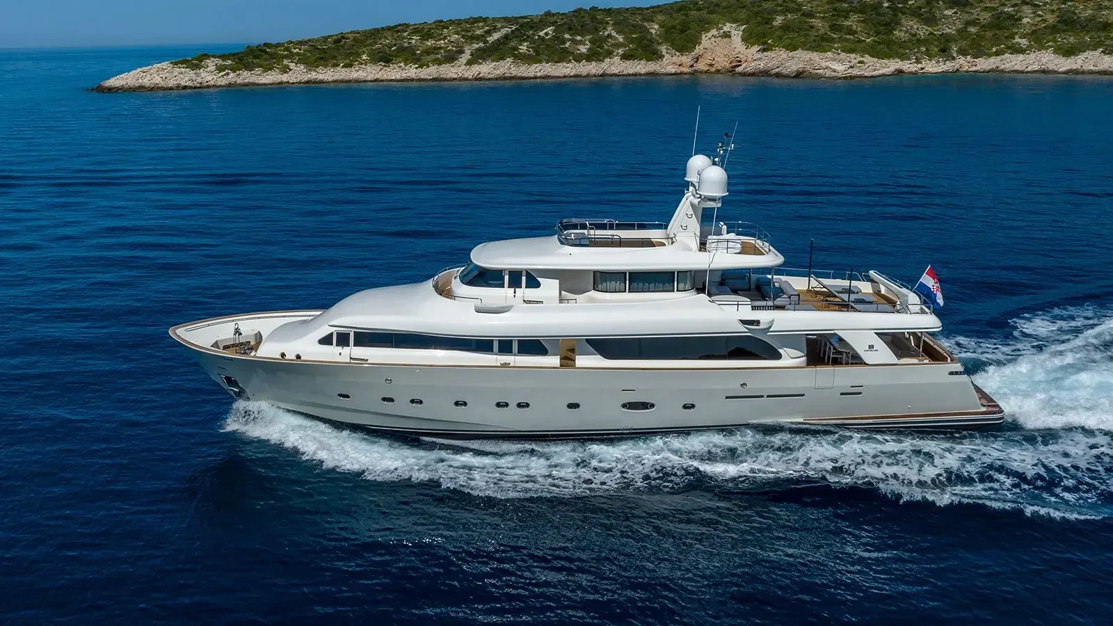 a white yacht on the water aboard KLOBUK Yacht for Charter