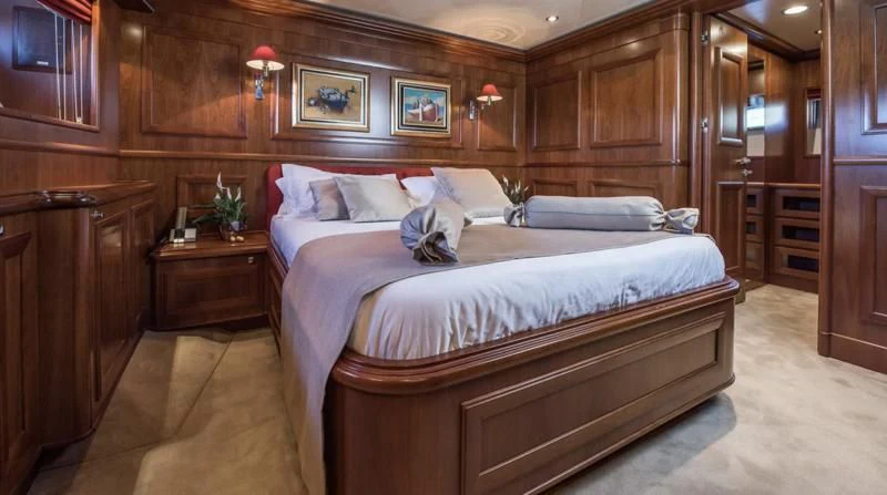 a bed in a room aboard KLOBUK Yacht for Charter