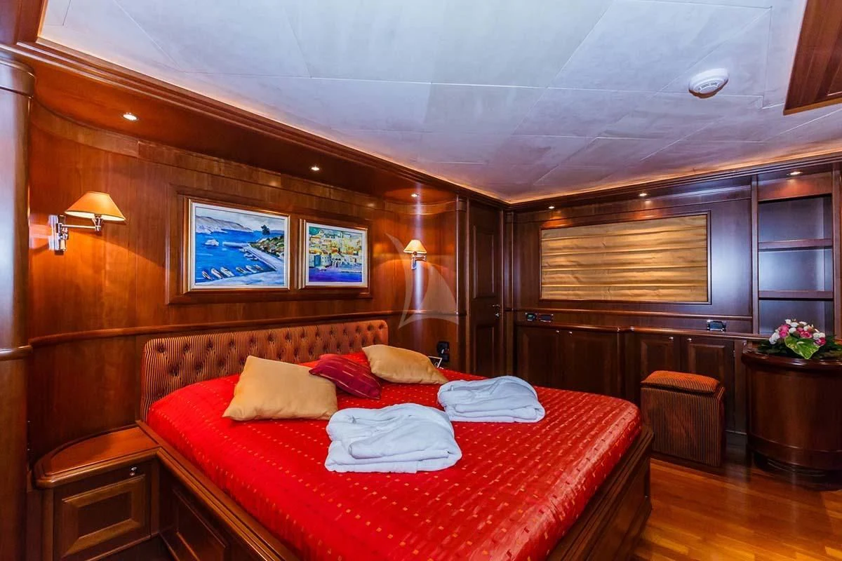 a bed in a room aboard KLOBUK Yacht for Charter