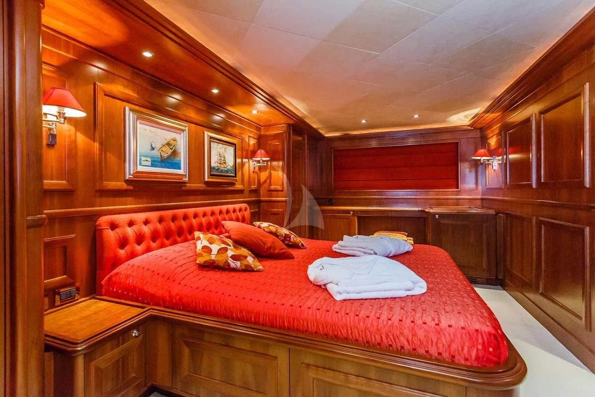 a bedroom with a bed aboard KLOBUK Yacht for Charter