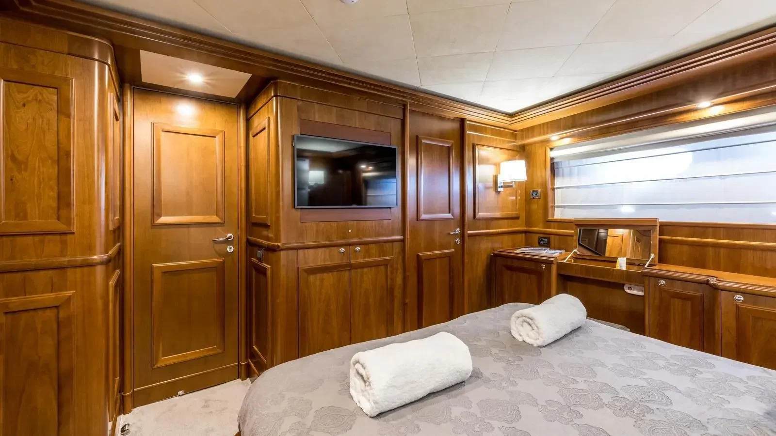 a bed in a room aboard KLOBUK Yacht for Charter