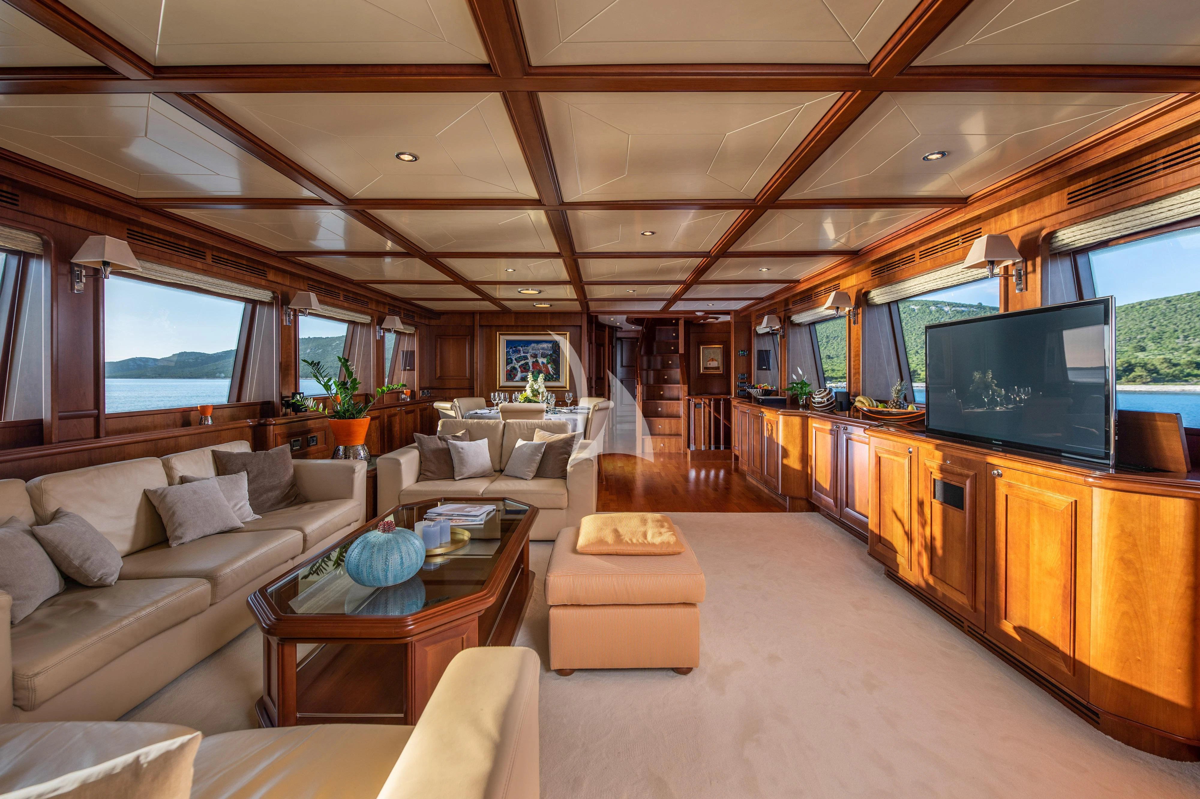 a living room with a large screen aboard KLOBUK Yacht for Charter