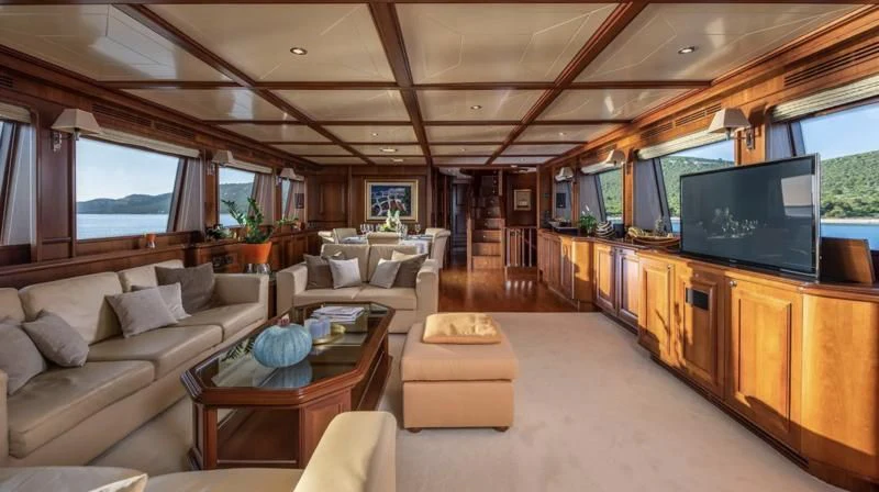 a living room with a large tv aboard KLOBUK Yacht for Charter