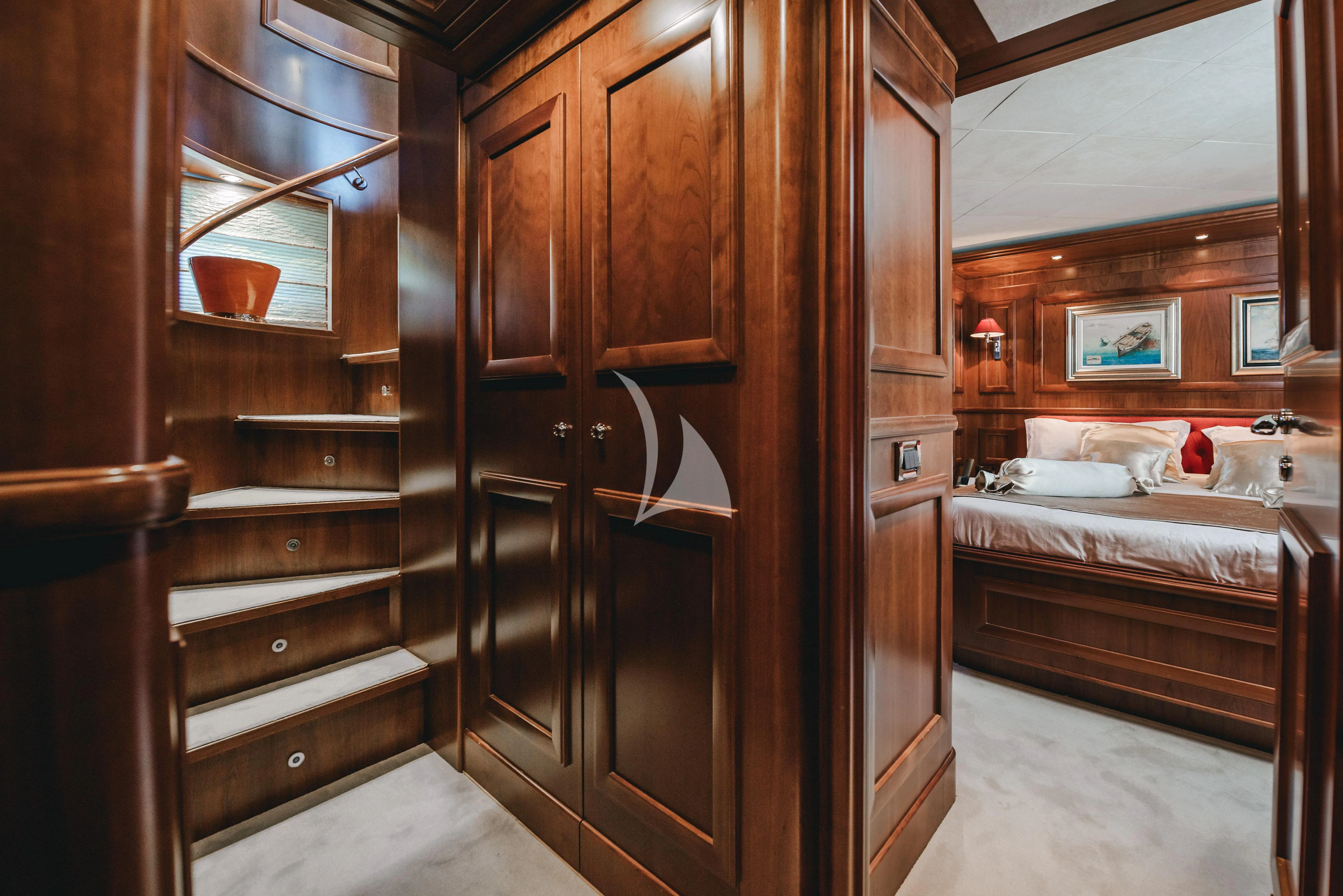 a room with wooden cabinets aboard KLOBUK Yacht for Charter