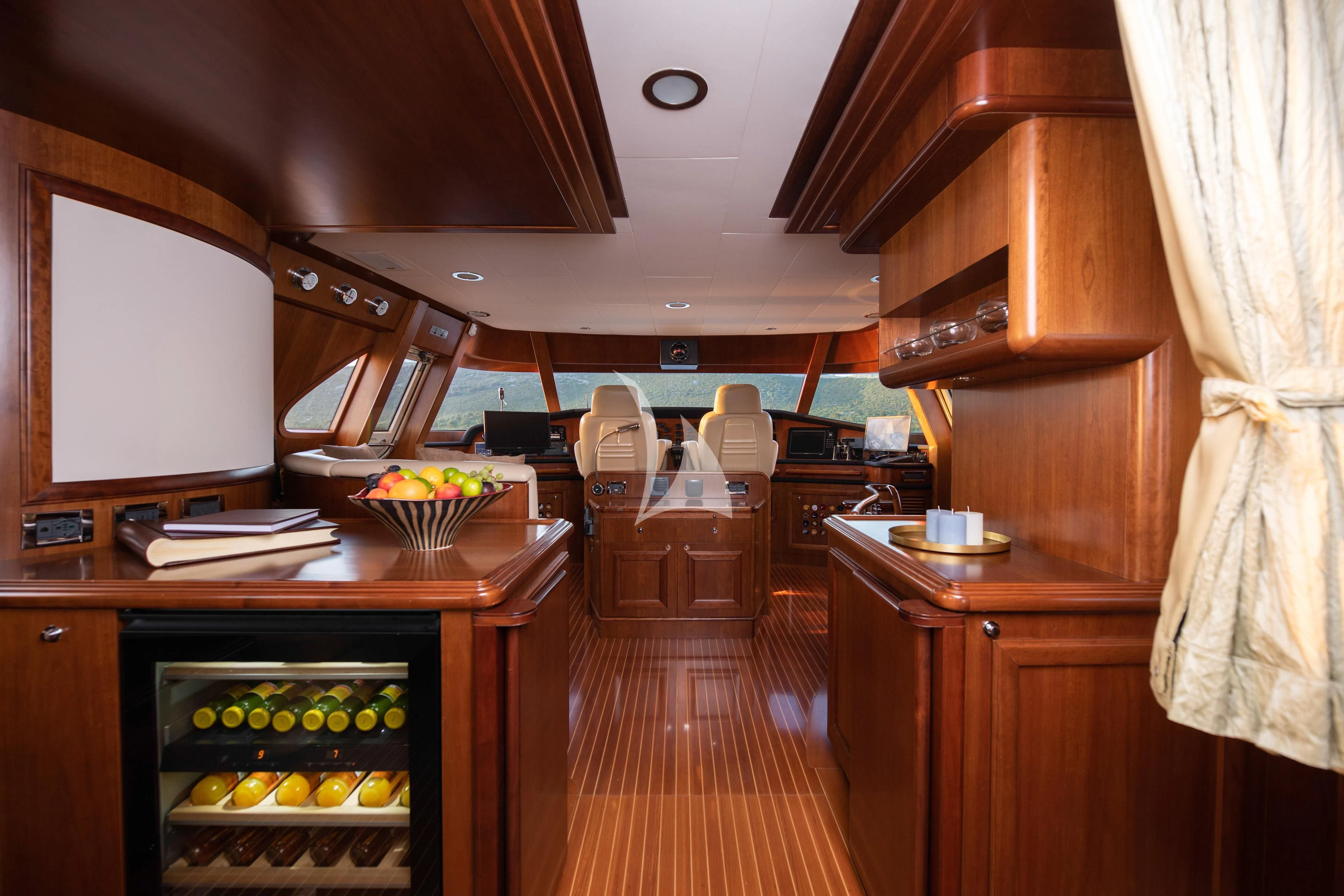 a kitchen with wooden cabinets aboard KLOBUK Yacht for Charter