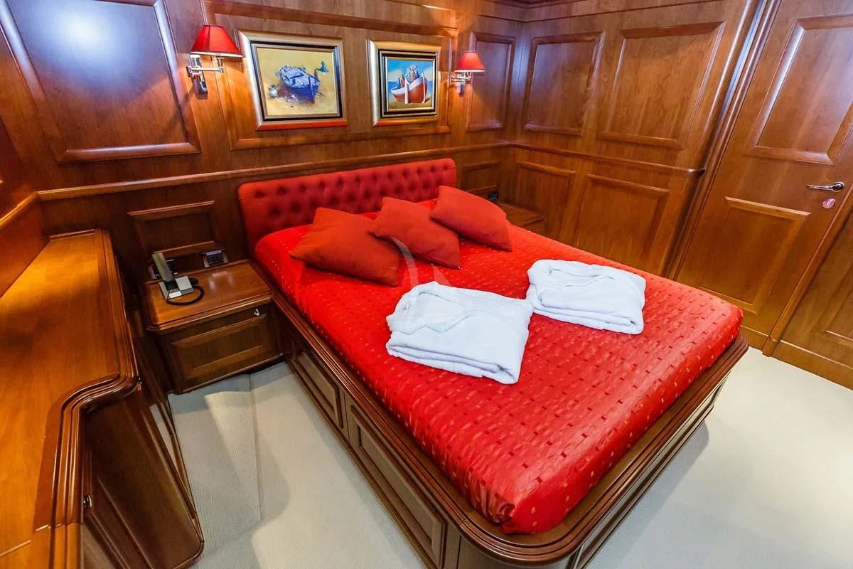 a bed in a room aboard KLOBUK Yacht for Charter
