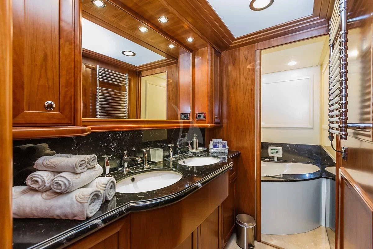 a bathroom with a sink and a tub aboard KLOBUK Yacht for Charter
