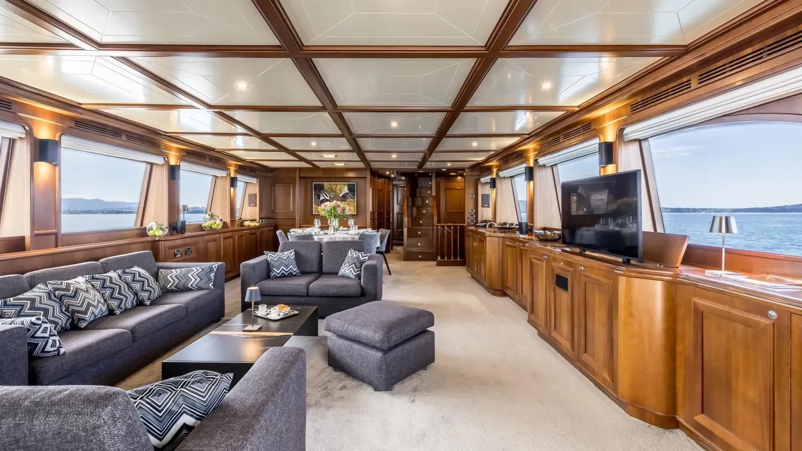 a living room with a large window aboard KLOBUK Yacht for Charter
