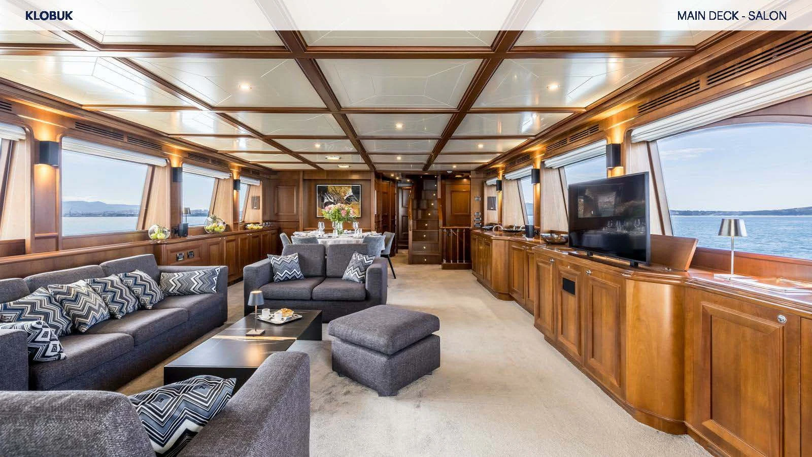 a living room with a large window aboard KLOBUK Yacht for Charter