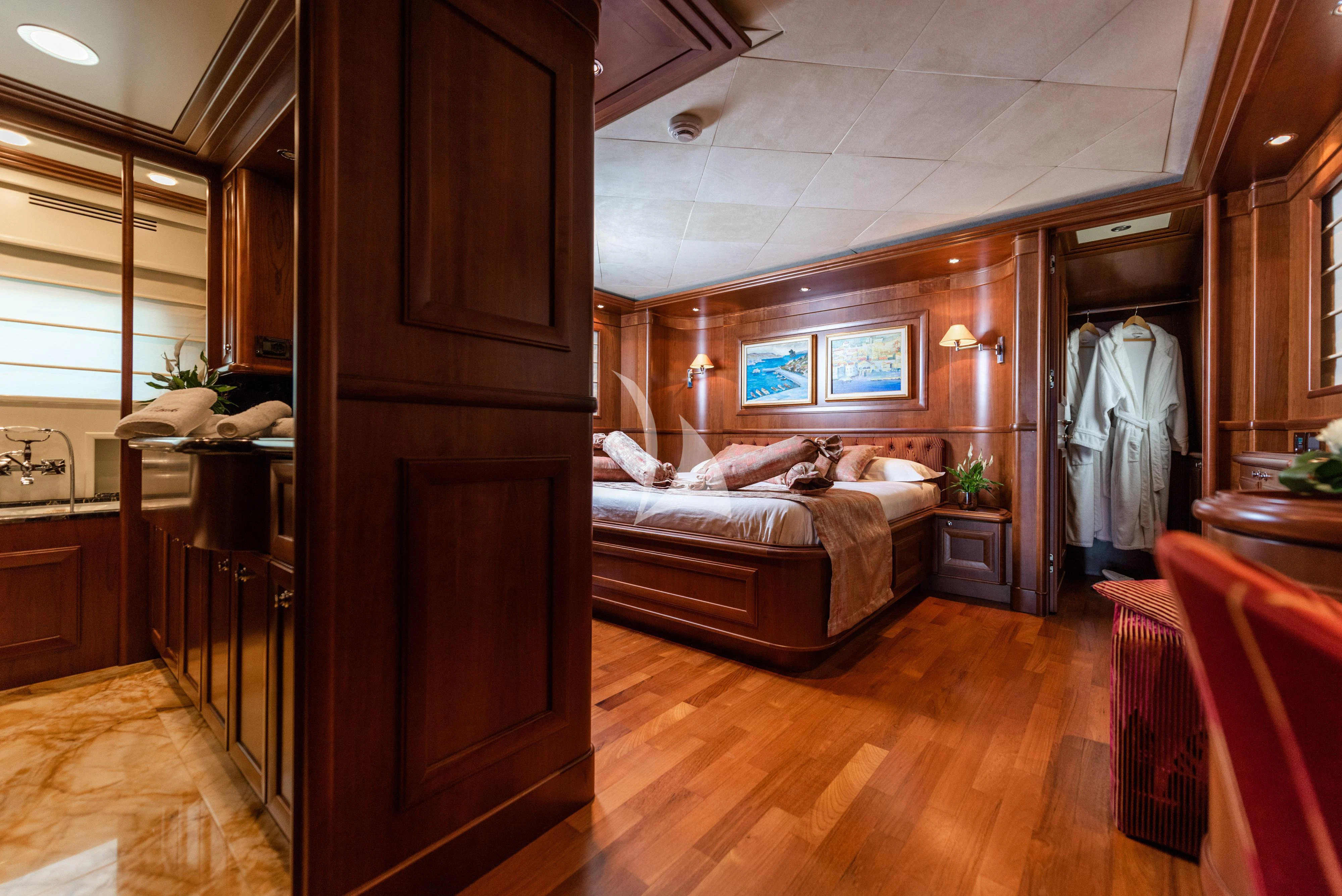 a bedroom with a wood floor aboard KLOBUK Yacht for Charter