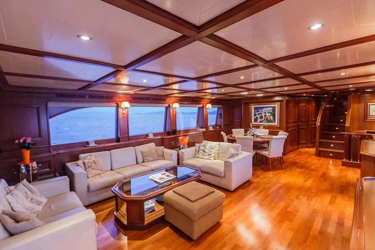a living room with a large window aboard KLOBUK Yacht for Charter