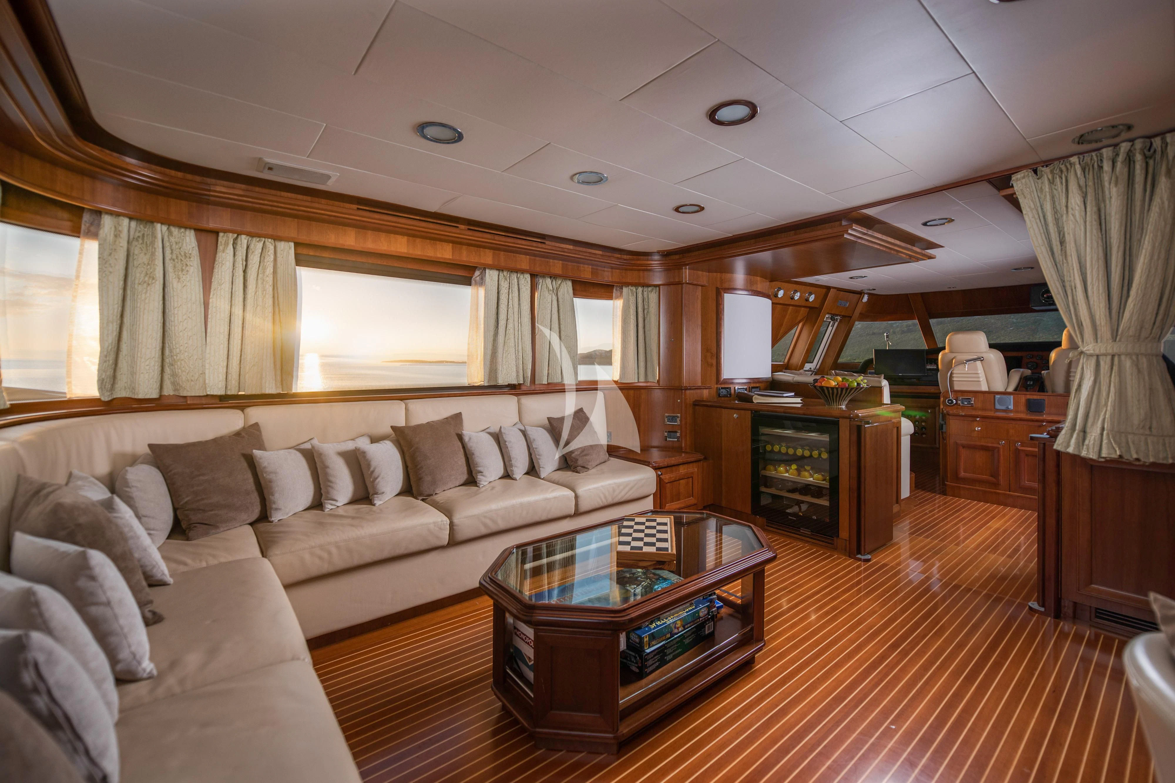 a living room with a couch and a coffee table aboard KLOBUK Yacht for Charter