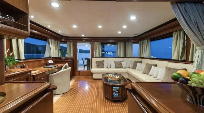 a living room with a large window aboard KLOBUK Yacht for Charter