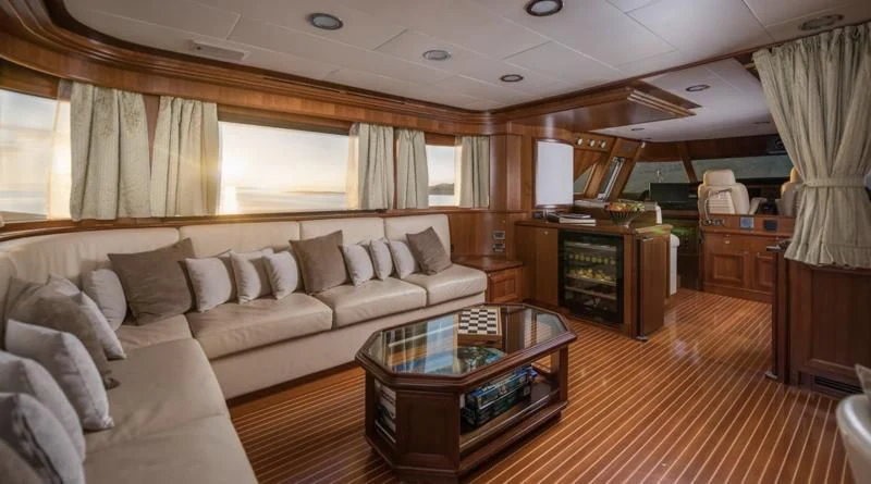 a living room with a couch and a coffee table aboard KLOBUK Yacht for Charter