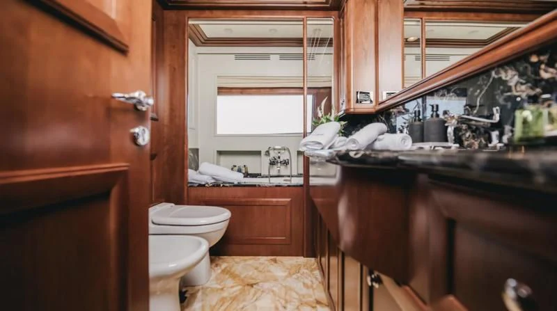 a bathroom with a sink and toilet aboard KLOBUK Yacht for Charter