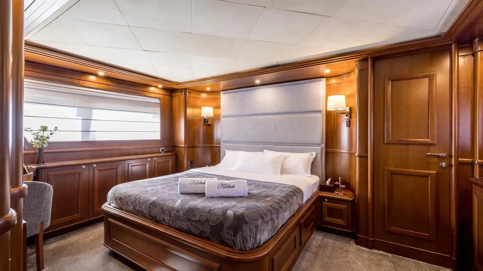 a bed in a room aboard KLOBUK Yacht for Charter